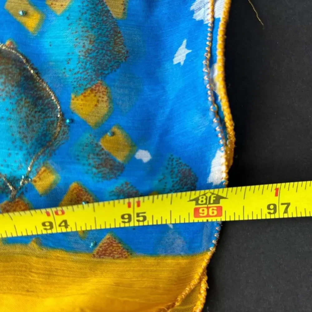Blue & yellow silk scarf with glitter, gold & white geometric shapes.